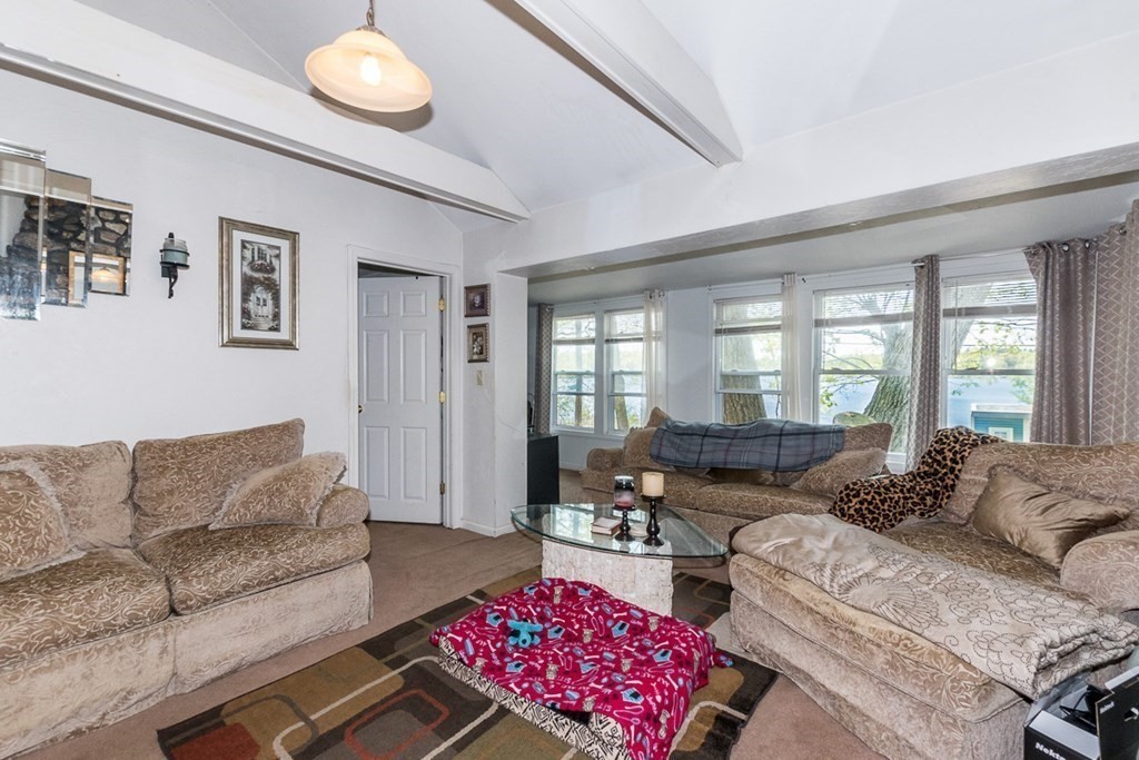 21 Victoria Avenue Rutland, MA 01543 - Photo 8 of 15 a living room with furniture and a large window