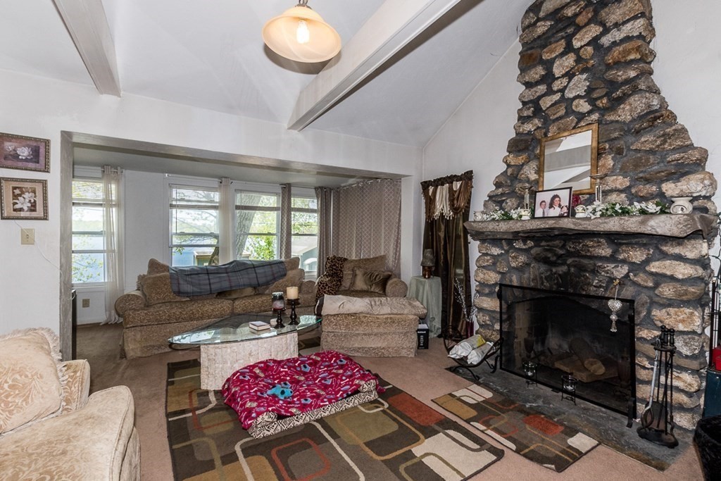 21 Victoria Avenue Rutland, MA 01543 - Photo 9 of 15 a living room with furniture and a fireplace