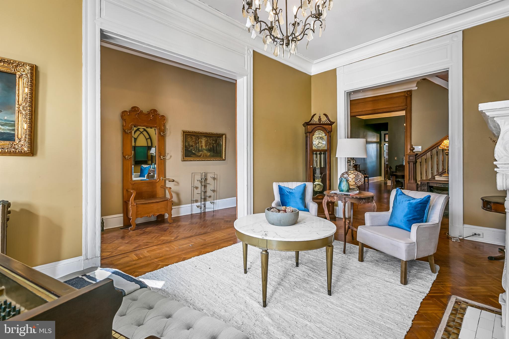 2243 Eutaw Place Baltimore, MD 21217 - Photo 15 of 54 a living room with furniture and a chandelier