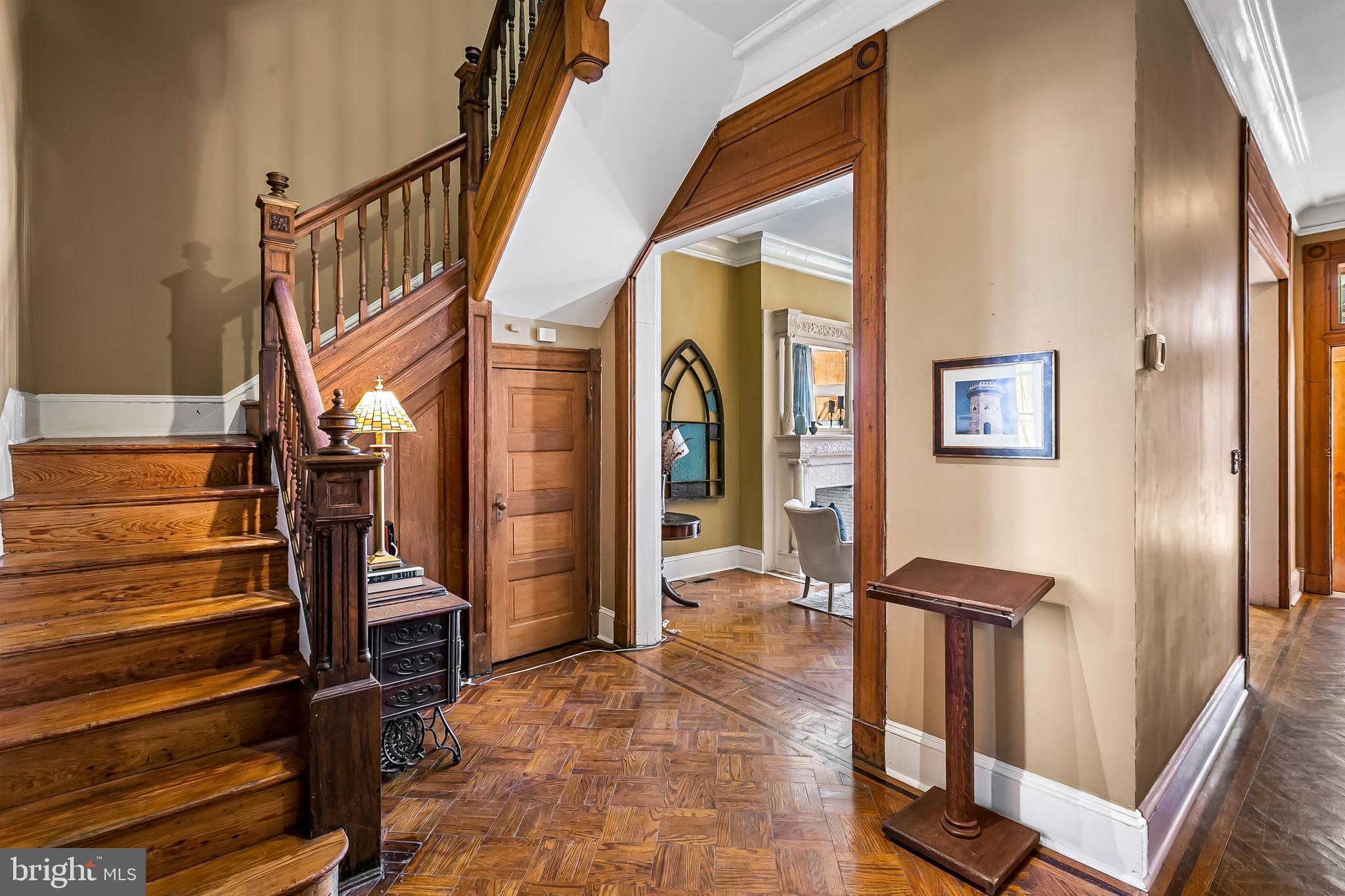 2243 Eutaw Place Baltimore, MD 21217 - Photo 16 of 54 a view of staircase with lots of frames on wall and a window