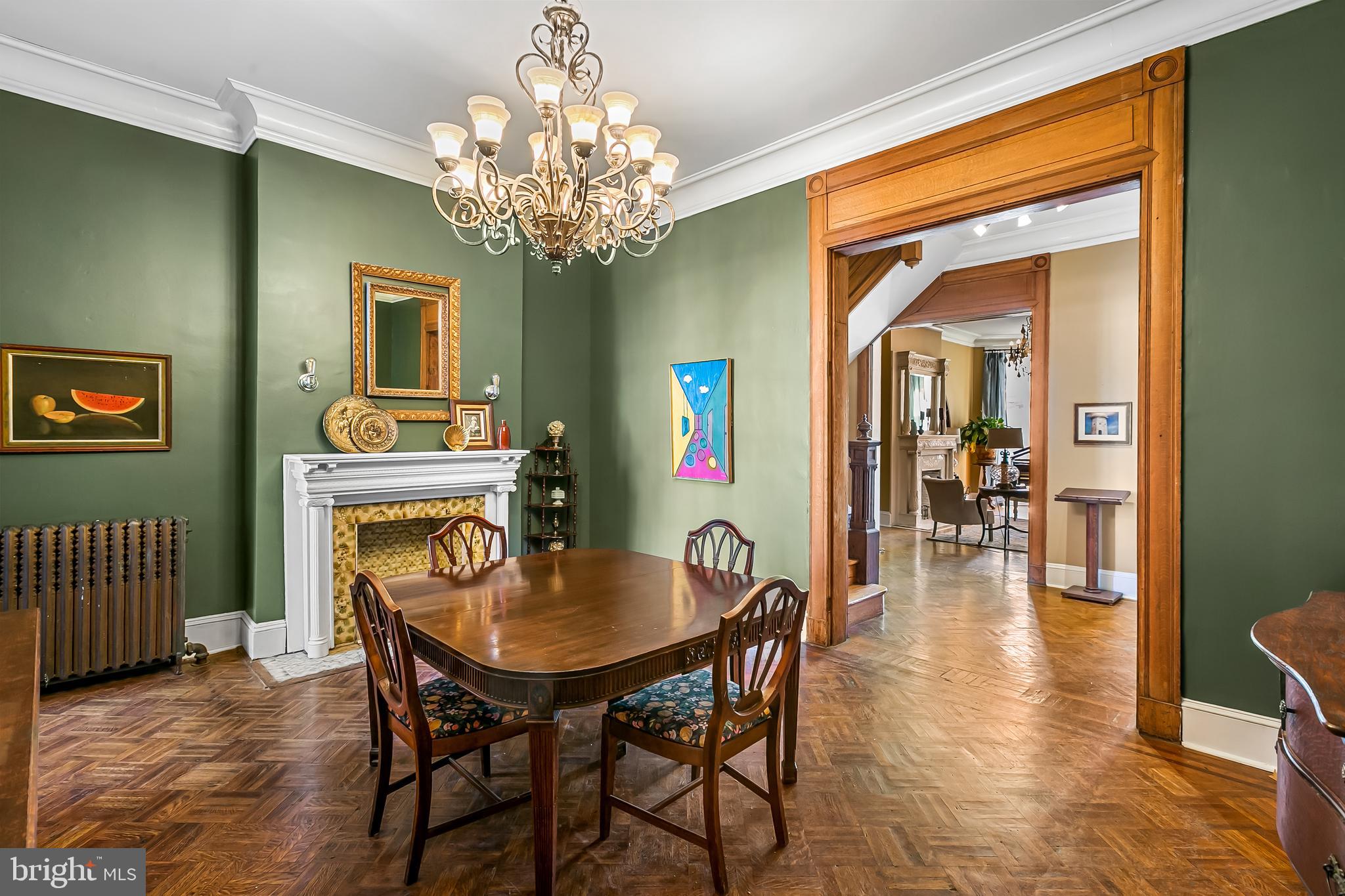 2243 Eutaw Place Baltimore, MD 21217 - Photo 19 of 54 a dining room with furniture a chandelier and wooden floor