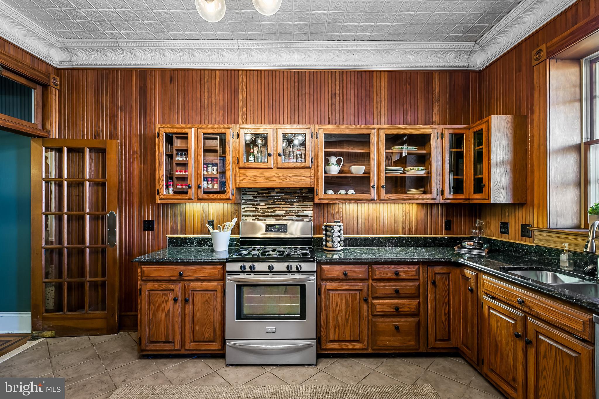 2243 Eutaw Place Baltimore, MD 21217 - Photo 24 of 54 a kitchen with stainless steel appliances granite countertop a stove and cabinets
