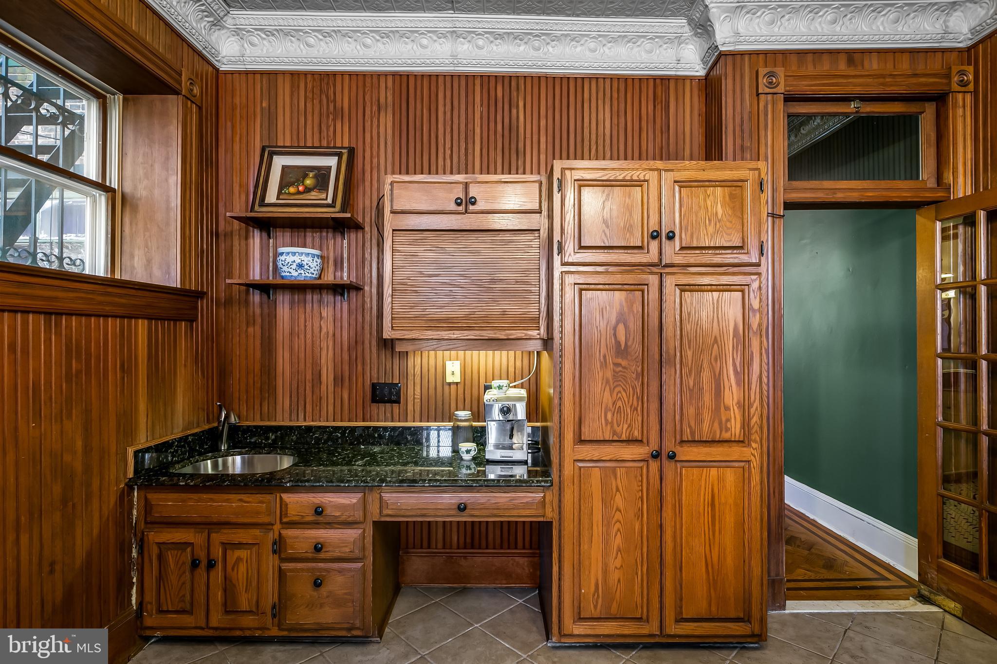 2243 Eutaw Place Baltimore, MD 21217 - Photo 27 of 54 a kitchen with stainless steel appliances granite countertop a refrigerator and a stove