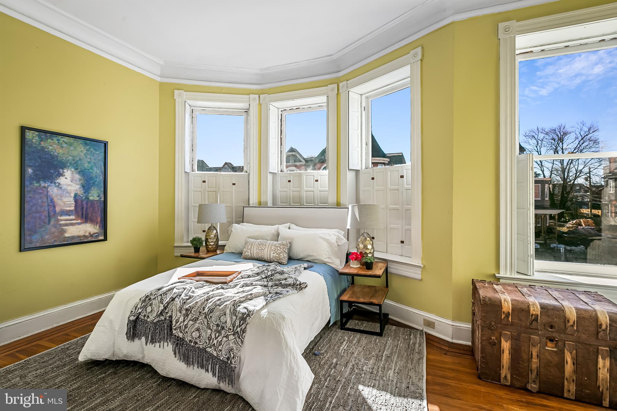 2243 Eutaw Place Baltimore, MD 21217 - Photo 34 of 54 a bedroom with a bed and a painting on the wall