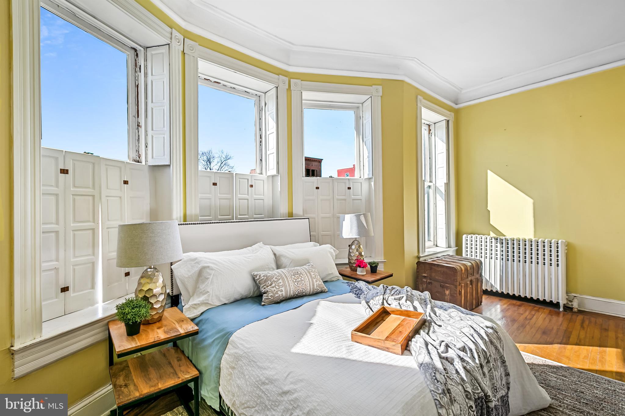 2243 Eutaw Place Baltimore, MD 21217 - Photo 35 of 54 a bedroom with furniture and wooden floor