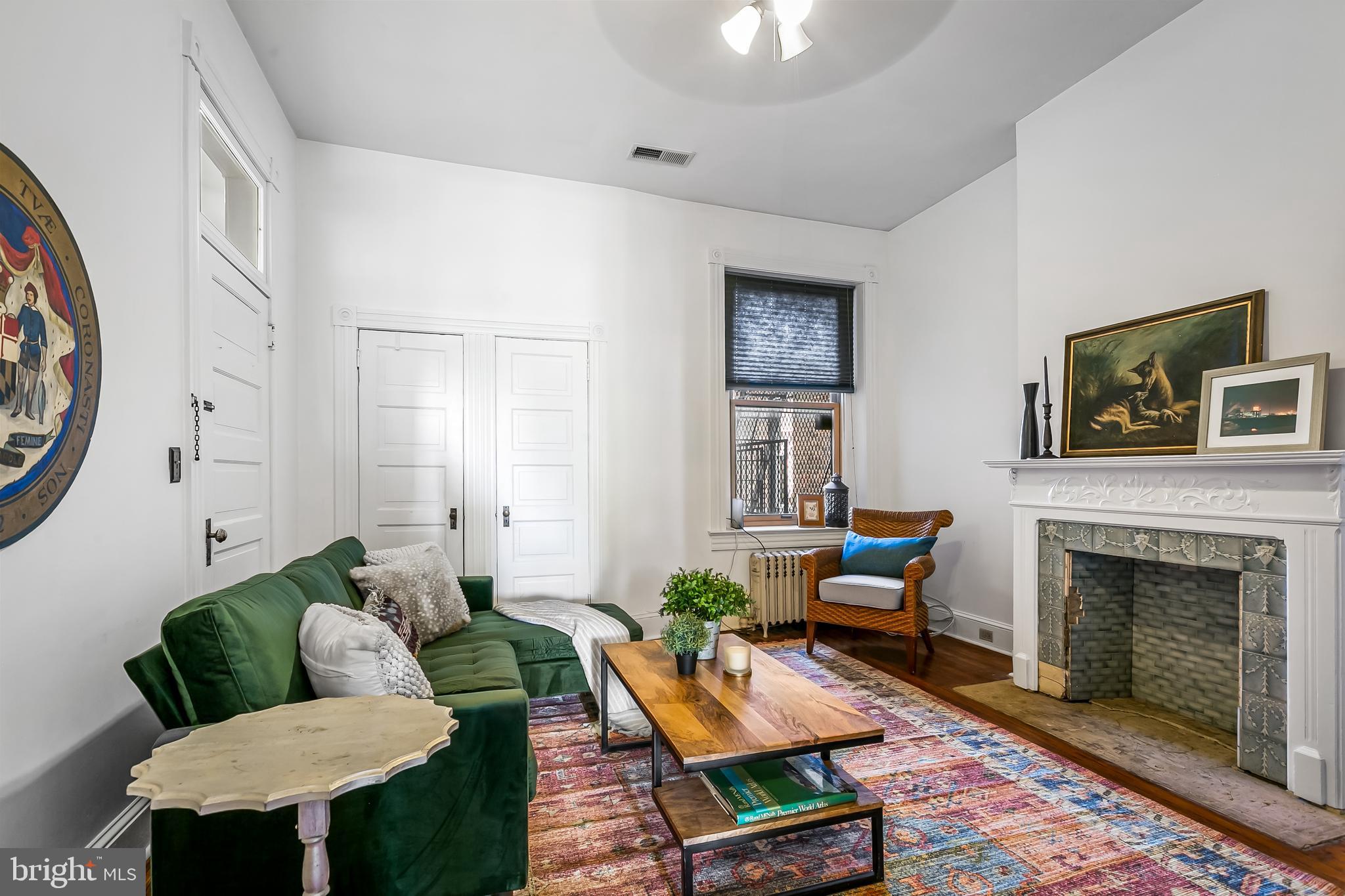 2243 Eutaw Place Baltimore, MD 21217 - Photo 37 of 54 a living room with furniture and a fireplace