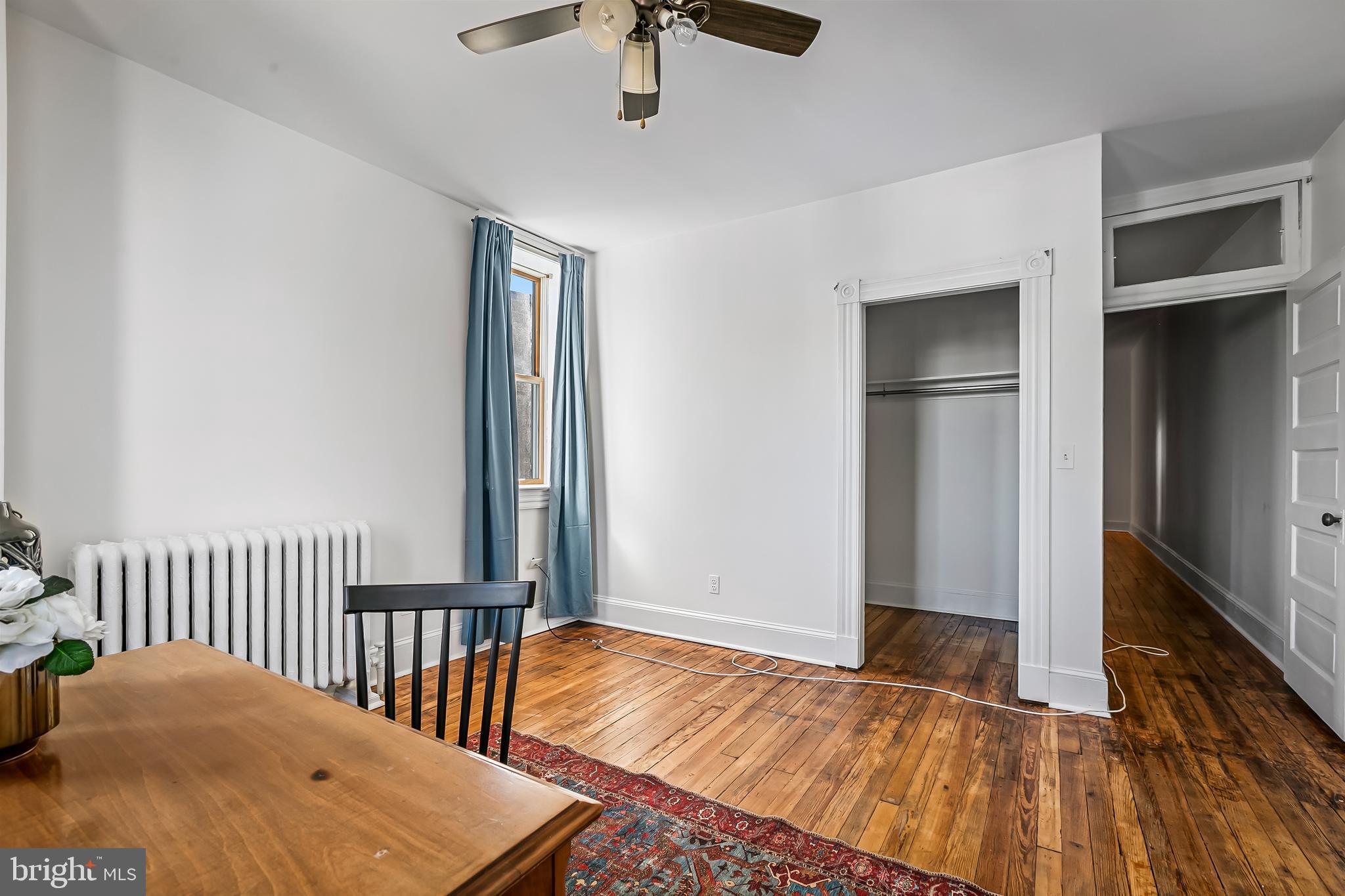 2243 Eutaw Place Baltimore, MD 21217 - Photo 48 of 54 a view of a bedroom with wooden floor