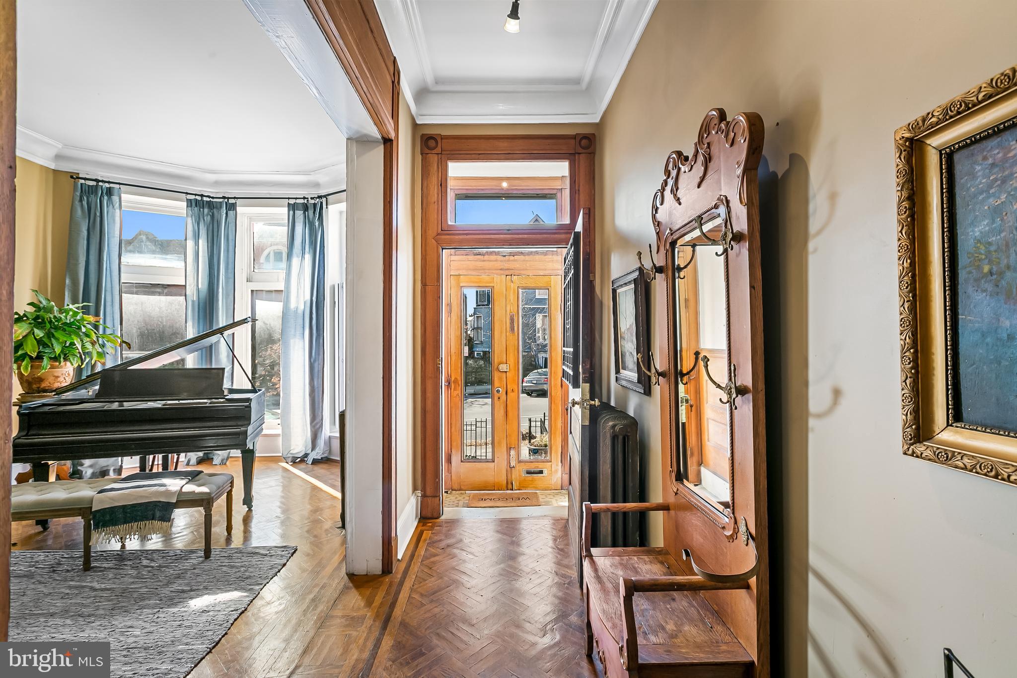 2243 Eutaw Place Baltimore, MD 21217 - Photo 10 of 54 a living room with furniture and a piano