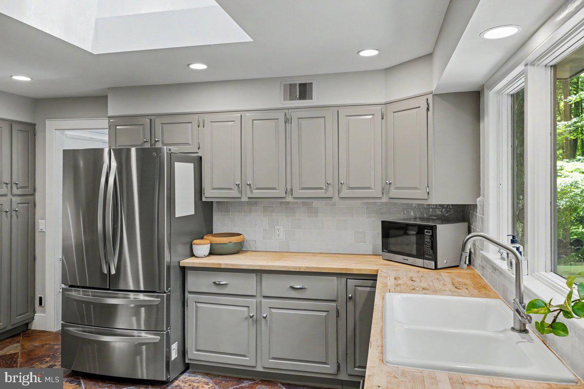 13 High Road New Hope, PA 18938 - Photo 14 of 56 a kitchen with a refrigerator sink and cabinets