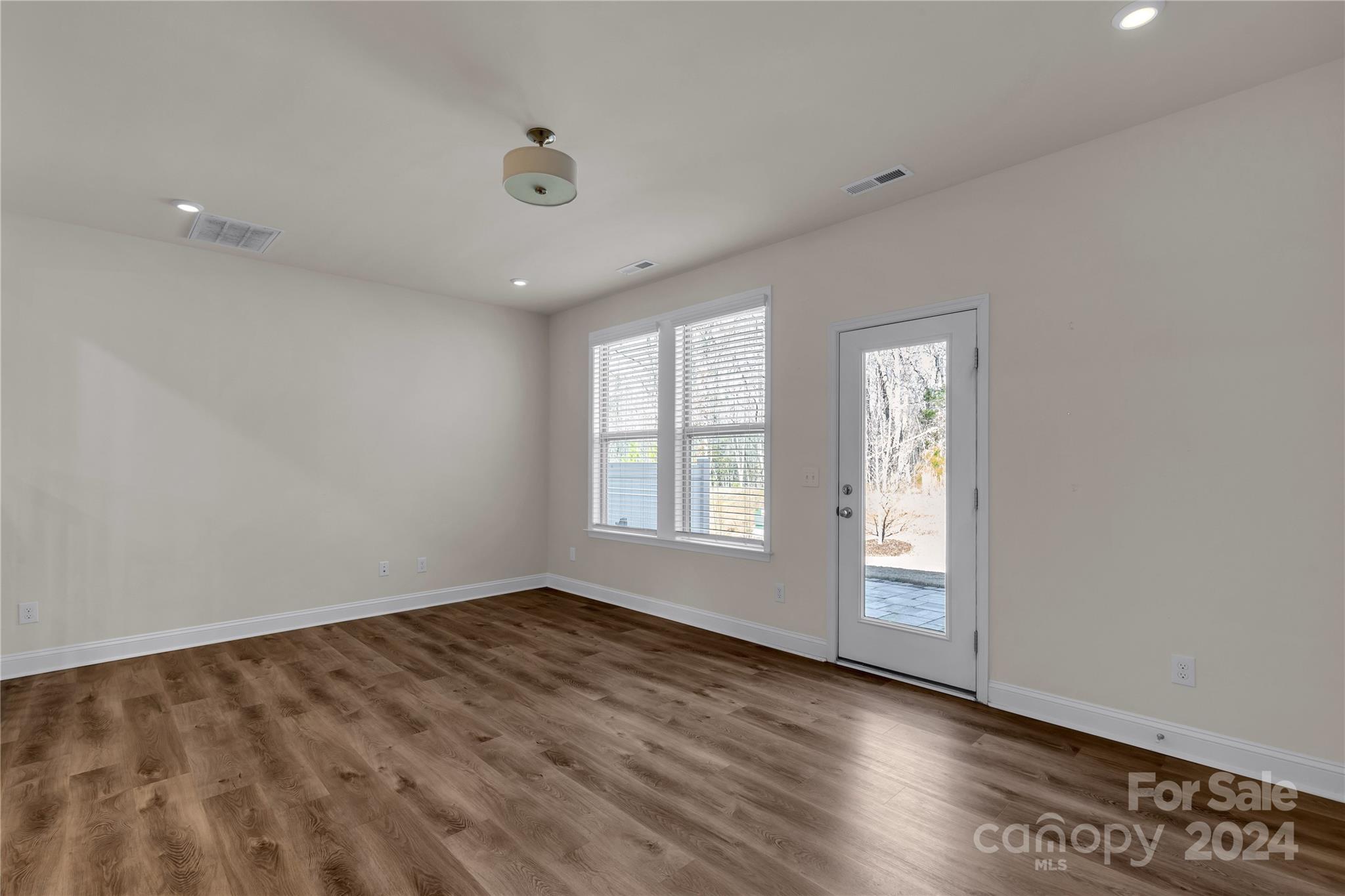 2026 Sutton View Road, Unit 693 Fort Mill, SC 29708 - Photo 11 of 26 a view of empty room with wooden floor and fan
