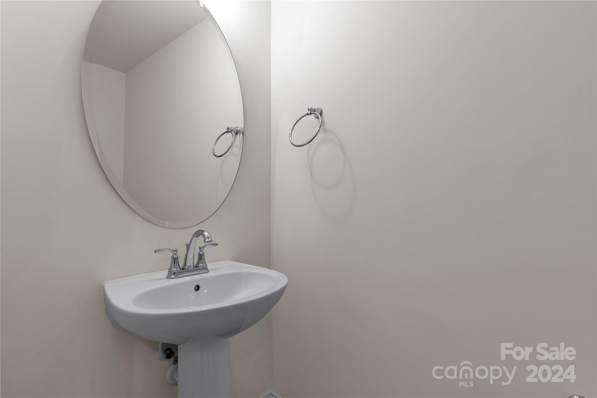 2026 Sutton View Road, Unit 693 Fort Mill, SC 29708 - Photo 12 of 26 a bathroom with a sink and mirror