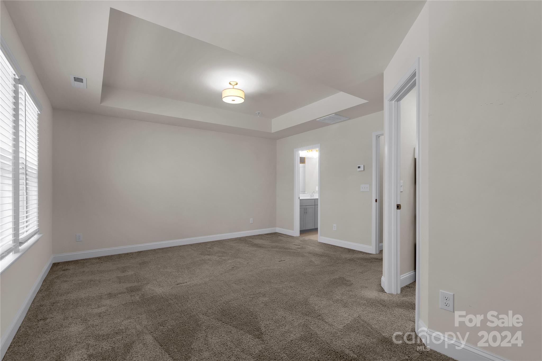 2026 Sutton View Road, Unit 693 Fort Mill, SC 29708 - Photo 15 of 26 an empty room with windows and closet