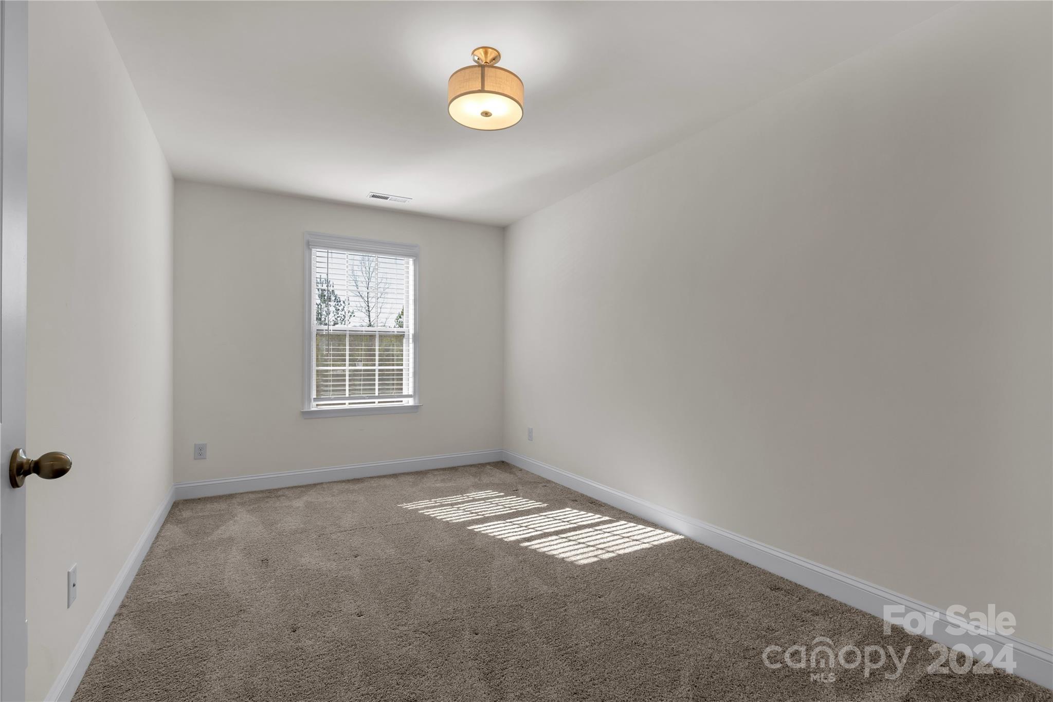 2026 Sutton View Road, Unit 693 Fort Mill, SC 29708 - Photo 18 of 26 an empty room with a empty space and a window