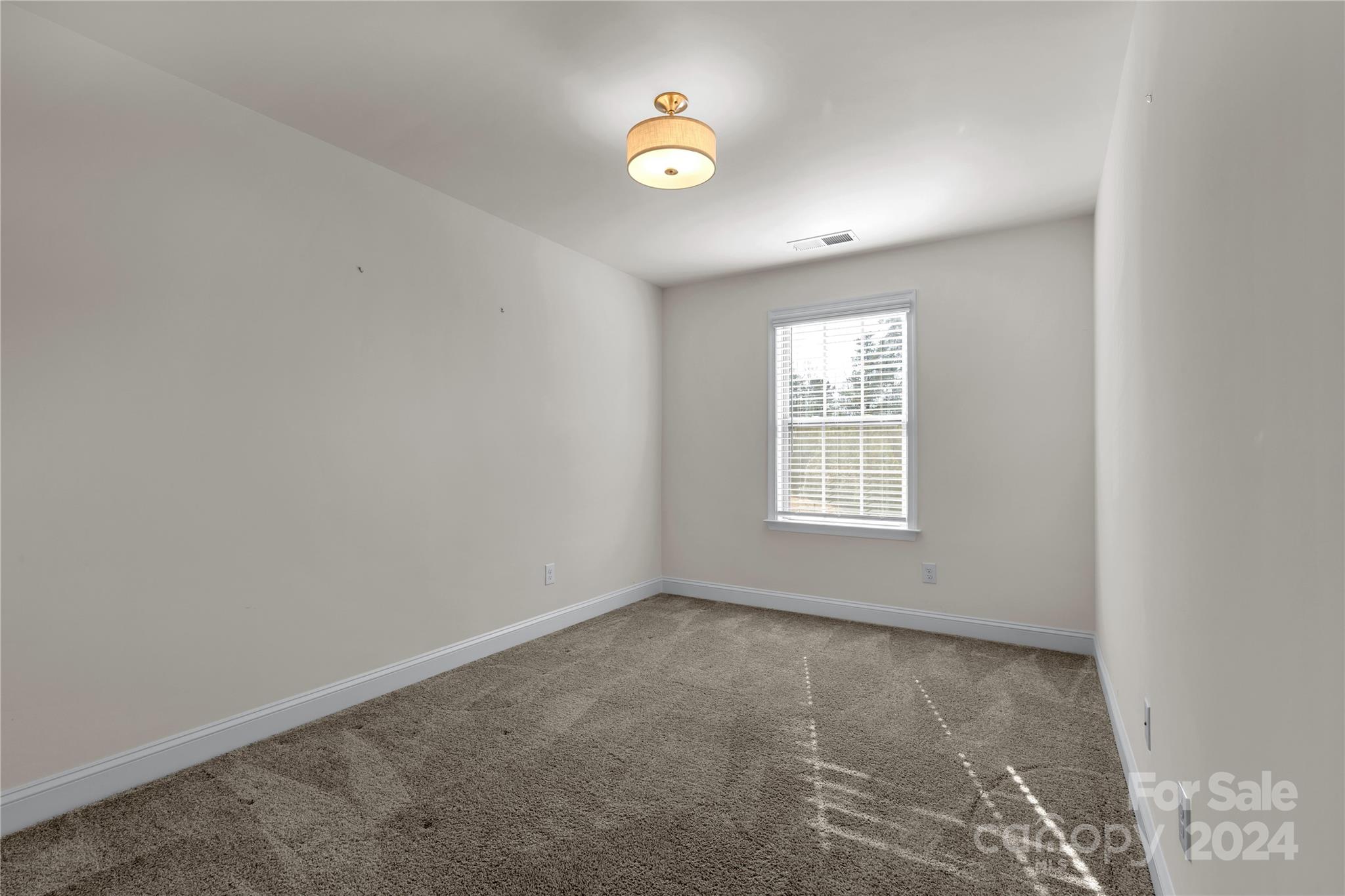 2026 Sutton View Road, Unit 693 Fort Mill, SC 29708 - Photo 20 of 26 an empty room with a window