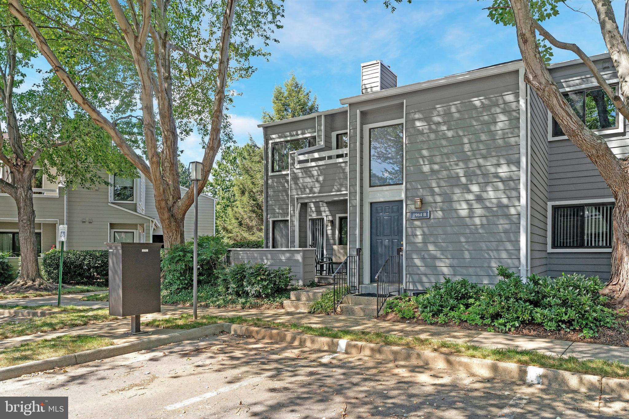 a view of a brick building next to a yard