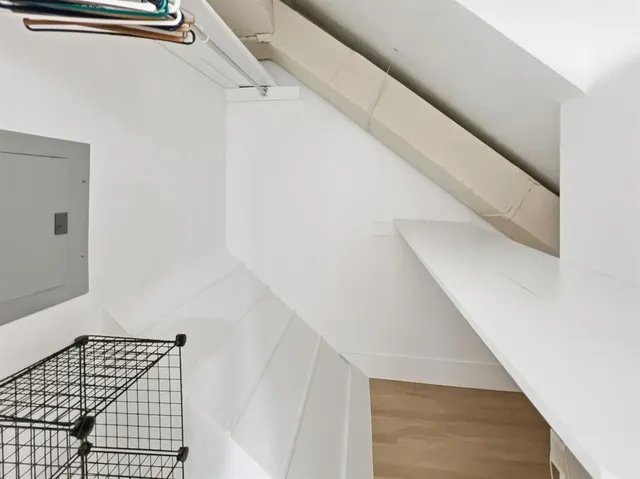 a view of staircase with white walls and stairs