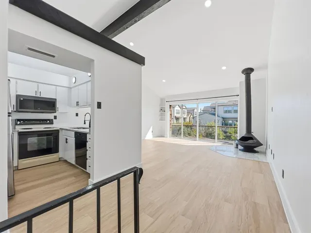 a view of wooden floor and an empty room