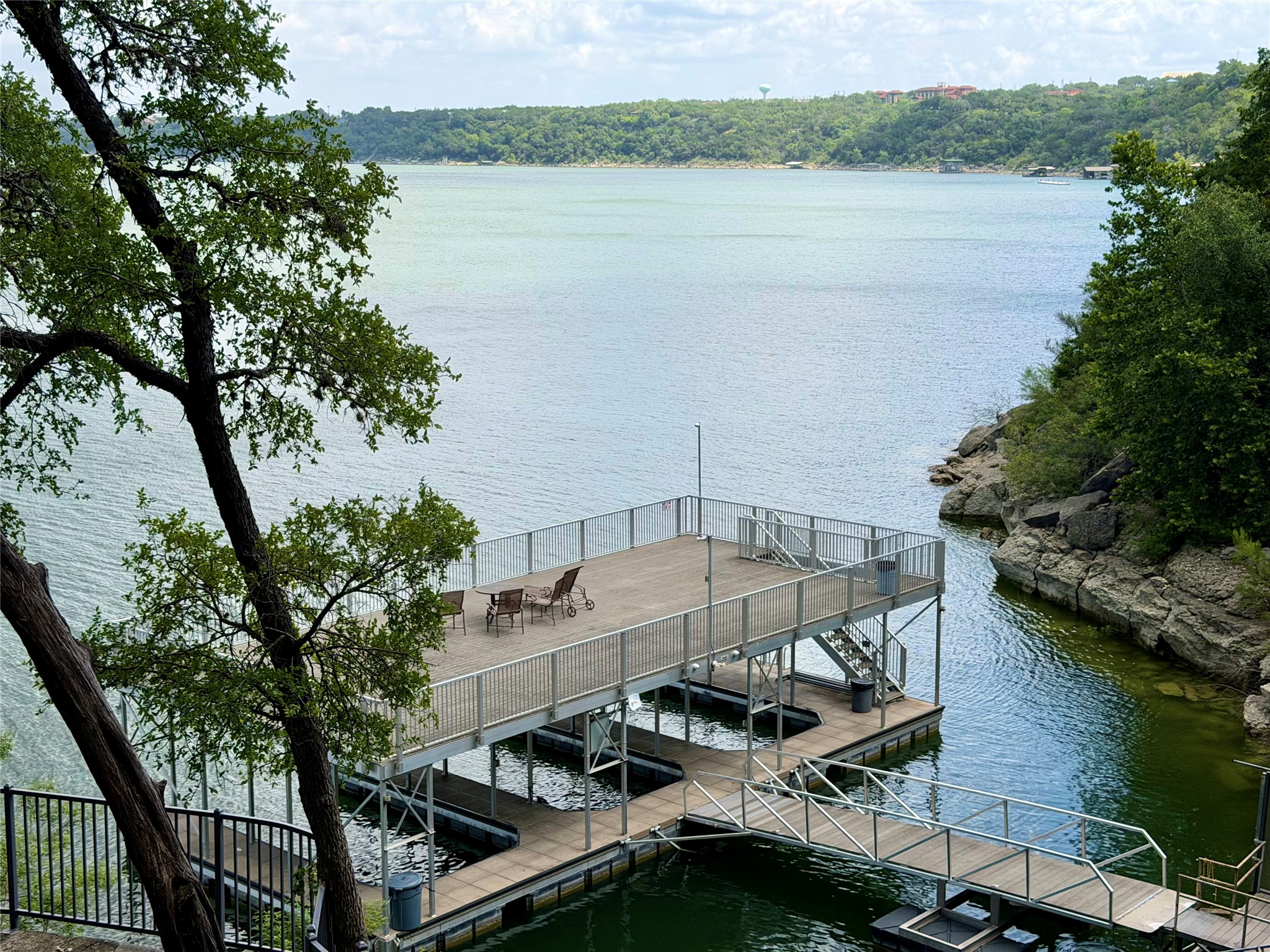 2918 Ranch Road 620 North, Unit C120 Austin, TX 78734 - Photo 30 of 34 Boasting direct water access, this private boat day dock and upper deck provide an ideal lakeside retreat.
