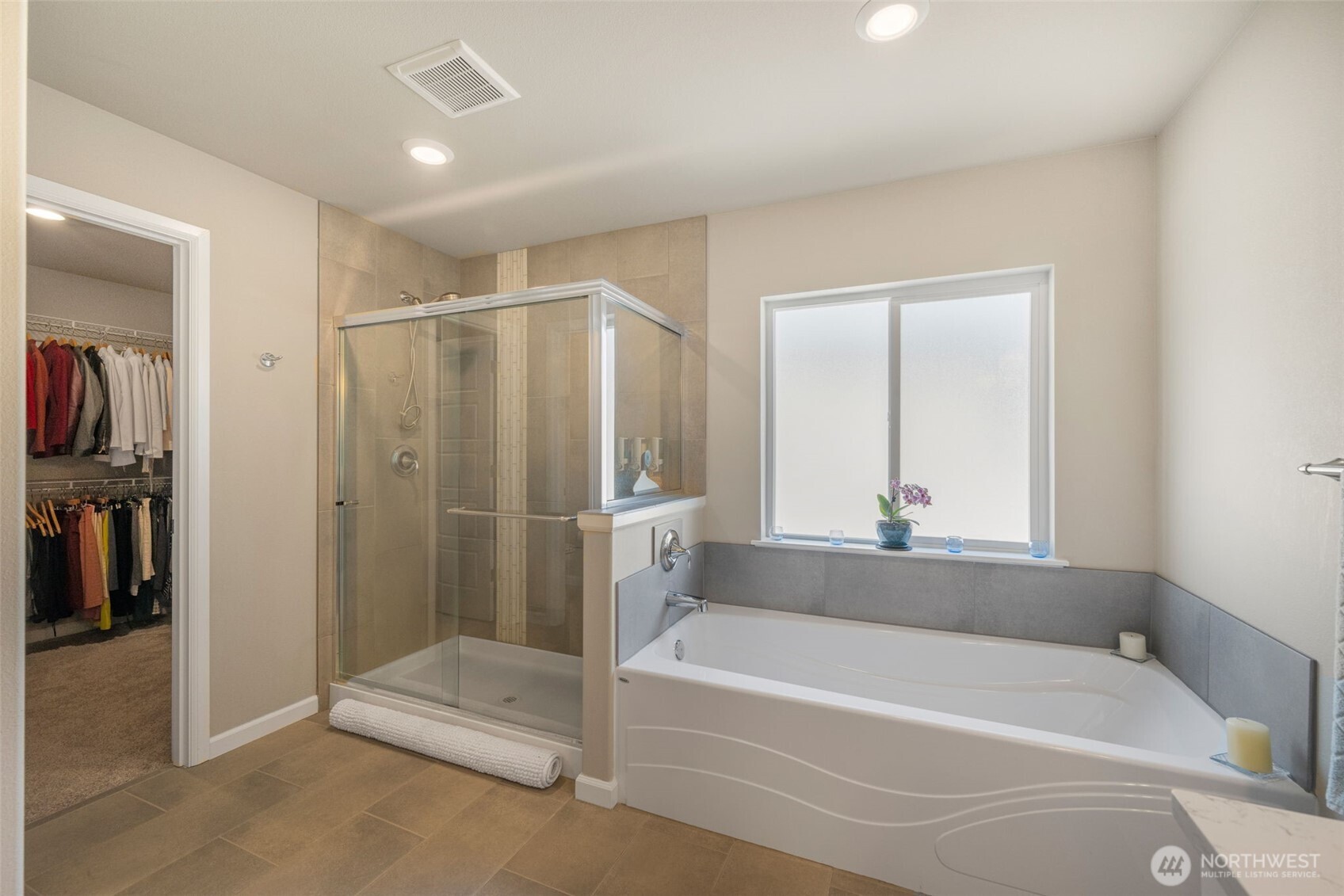 216 178th Street Southeast Bothell, WA 98012 - Photo 27 of 40 a bathroom with a bathtub and a shower