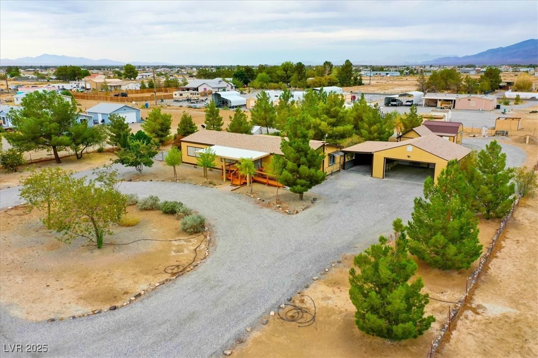 4361 Retread Road Pahrump, NV 89048 - Photo 72 of 75 Aerial perspective of suburban area with a mountain backdrop