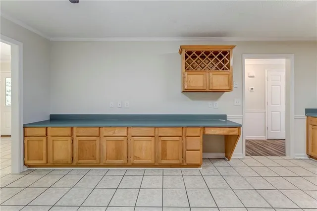 a view of a livingroom with an empty space and a window