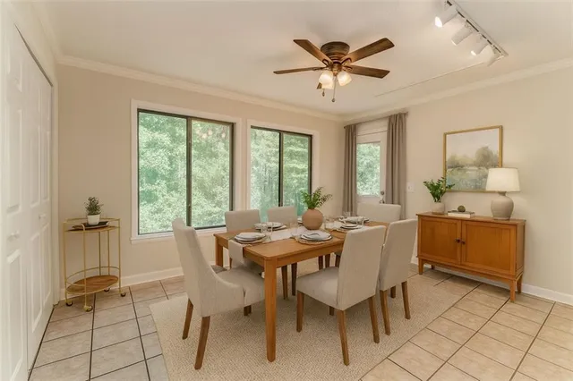 a view of a dining room with furniture window and outside view