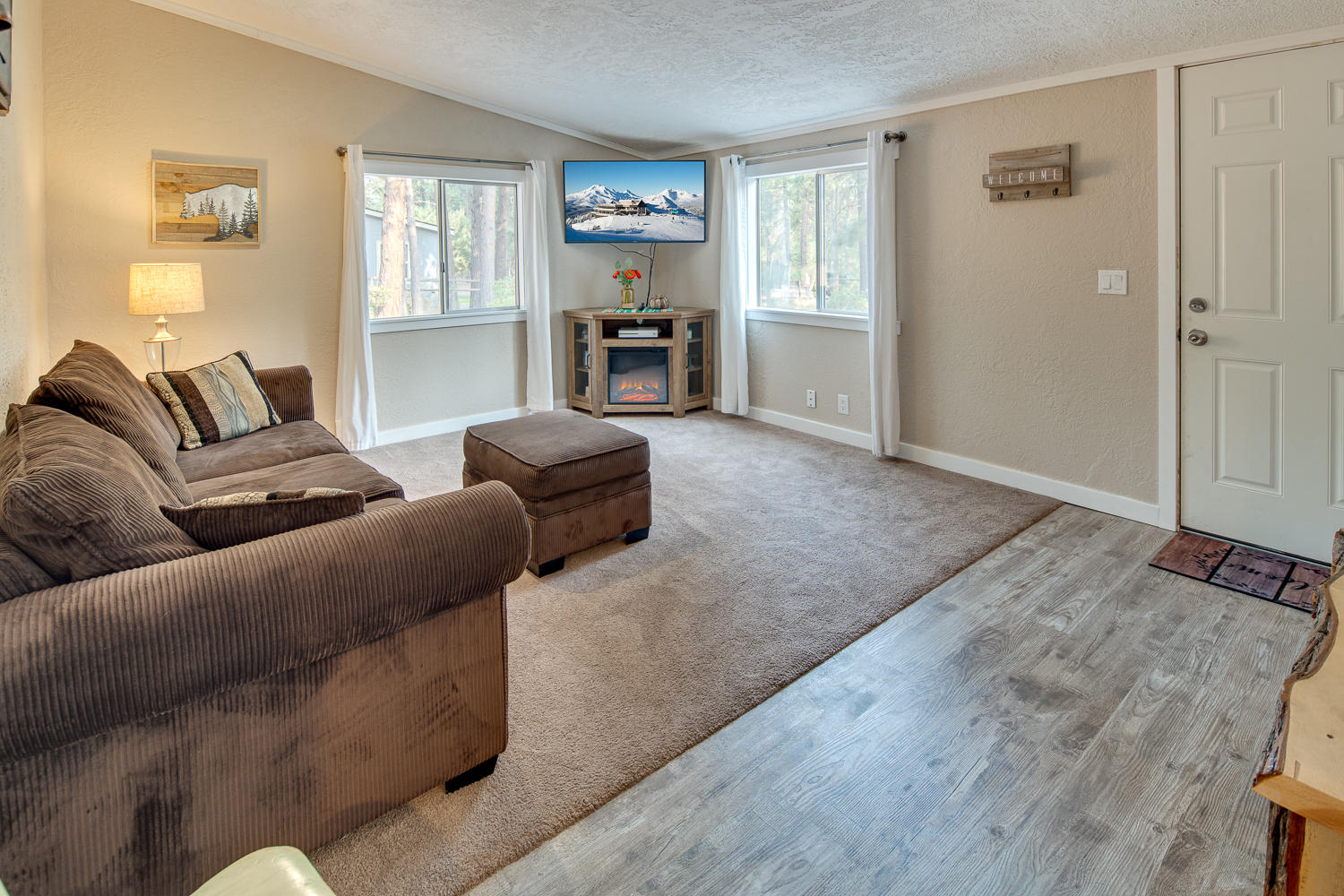 19197 Kiowa Road Bend, OR 97702 - Photo 16 of 32 a living room with furniture and a flat screen tv