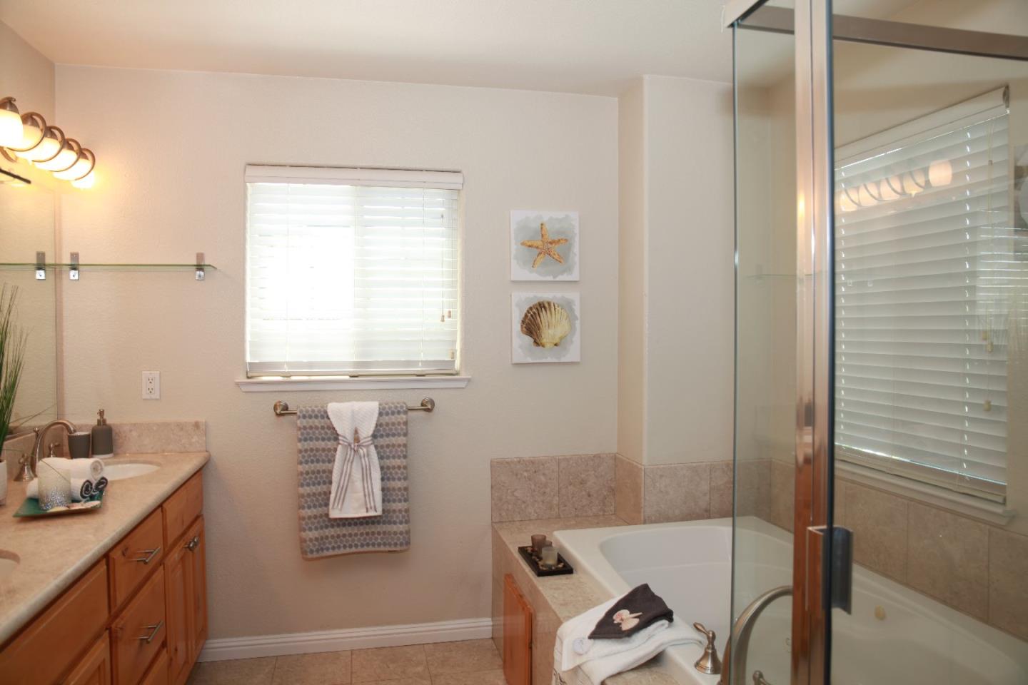 2381 Homestead Road Santa Clara, CA 95050 - Photo 14 of 20 a bathroom with a tub sink and a mirror