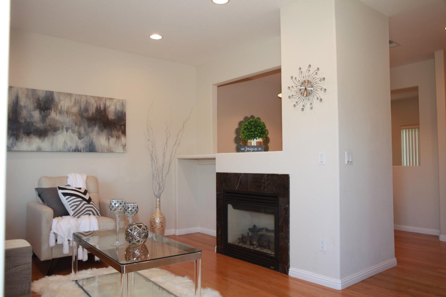 2381 Homestead Road Santa Clara, CA 95050 - Photo 4 of 20 a living room with furniture and a fireplace