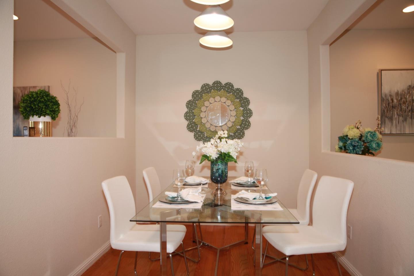 2381 Homestead Road Santa Clara, CA 95050 - Photo 5 of 20 a view of a dining room with furniture and wooden floor