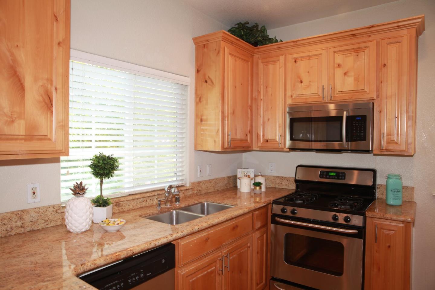 2381 Homestead Road Santa Clara, CA 95050 - Photo 10 of 20 a kitchen with a sink stove and microwave