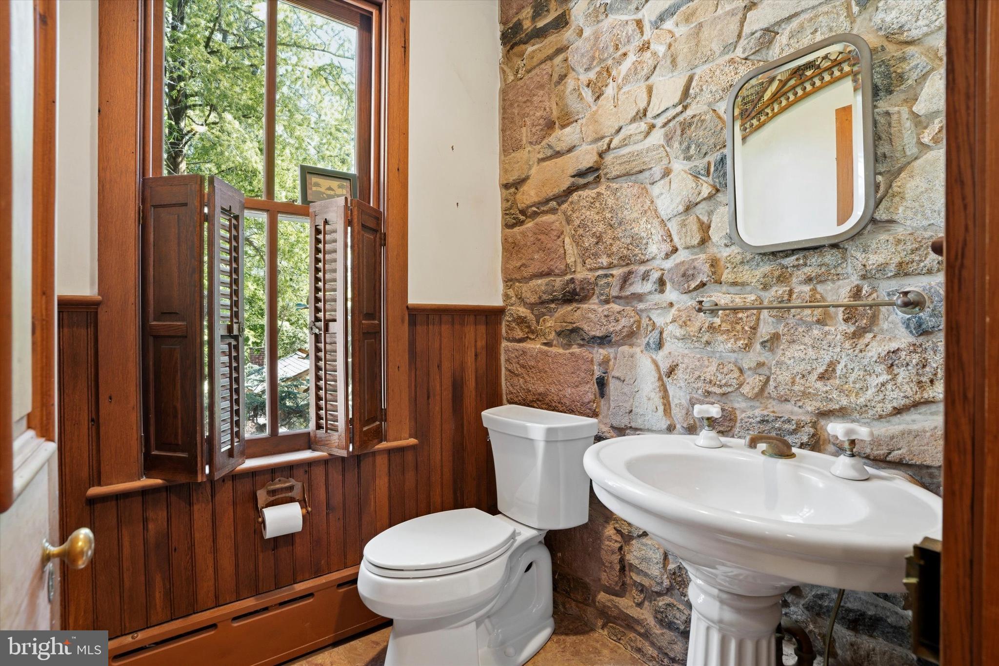 1451 Prizer Road Pottstown, PA 19465 - Photo 11 of 23 a bathroom with a toilet sink and mirror
