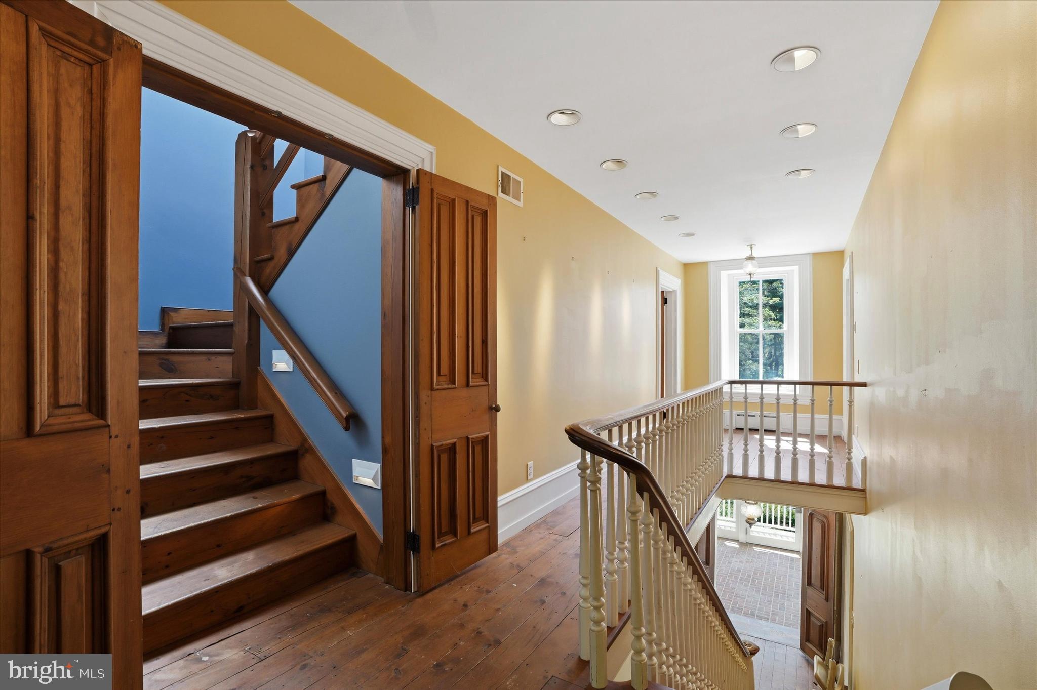 1451 Prizer Road Pottstown, PA 19465 - Photo 19 of 23 a view of an entryway with wooden floor and stairs
