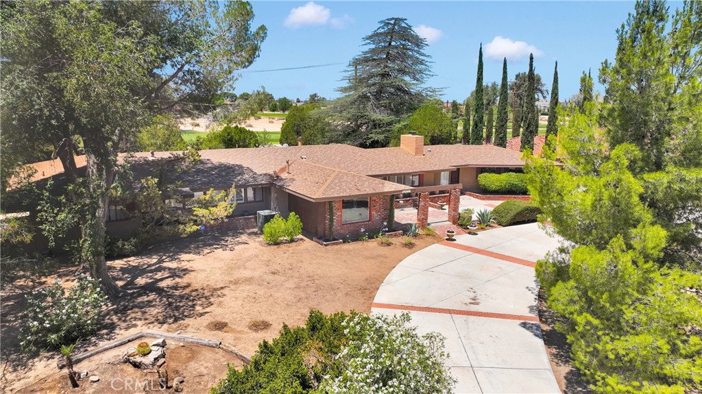 19955 Chickasaw Road Apple Valley, CA 92307 - Photo 59 of 60 a view of a house with a yard and pathway