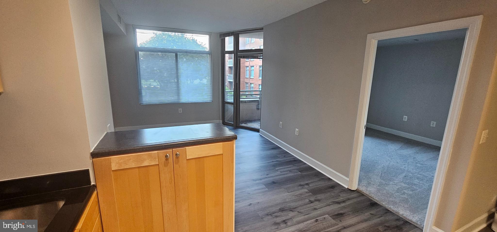 3600 South Glebe Road, Unit 330W Arlington, VA 22202 - Photo 11 of 34 wooden floor in an empty room with a window