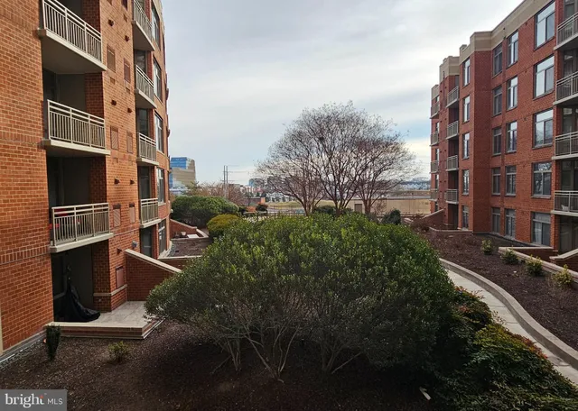 a swimming pool with outdoor seating and yard