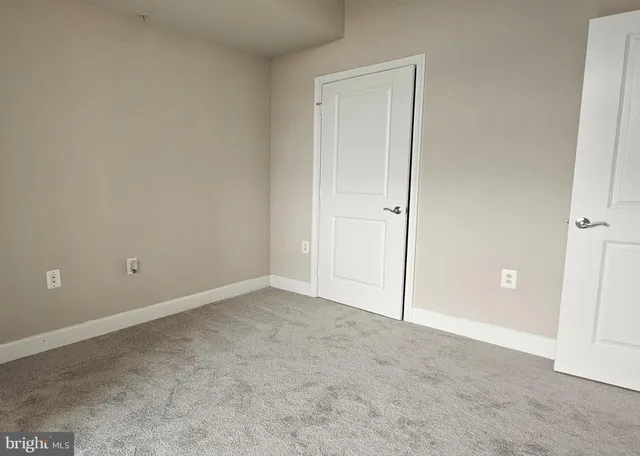 a roof deck with table and chairs a barbeque and potted plants