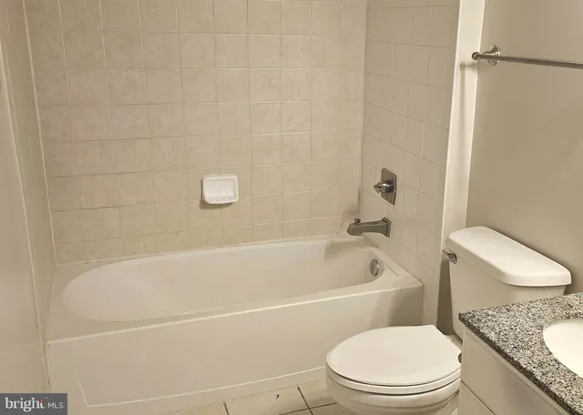 a dining room with wooden floor and glass door