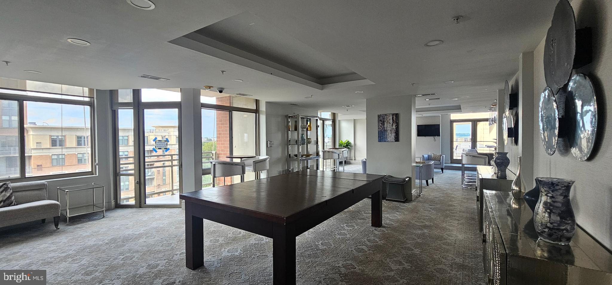 3600 South Glebe Road, Unit 330W Arlington, VA 22202 - Photo 30 of 34 a living room with furniture and a flat screen tv