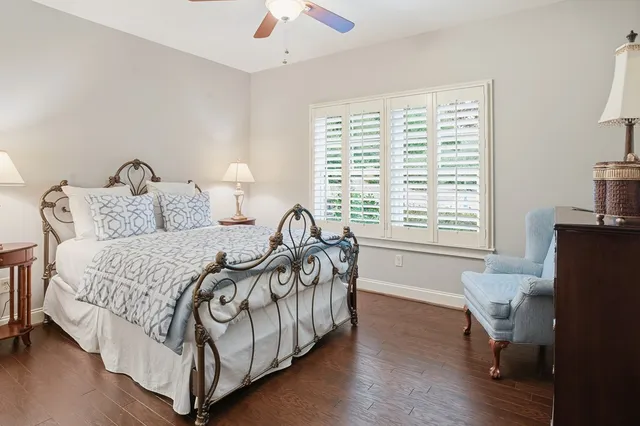 a bed room with a bed and a chair