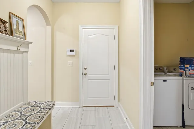 a view of a bedroom with wooden floor and closet