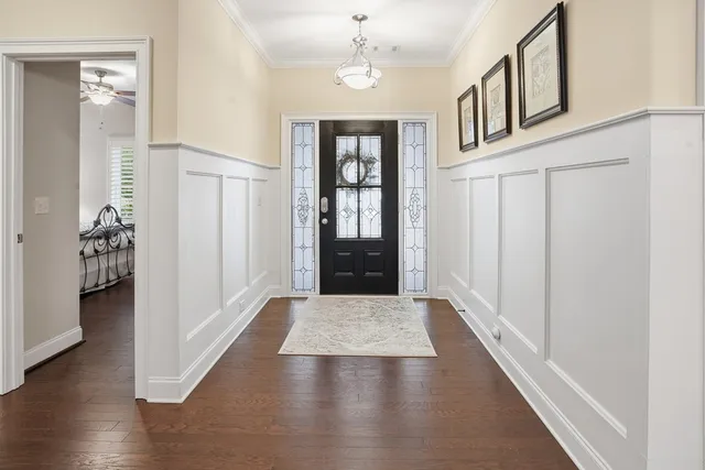 a view of an entryway with wooden floor