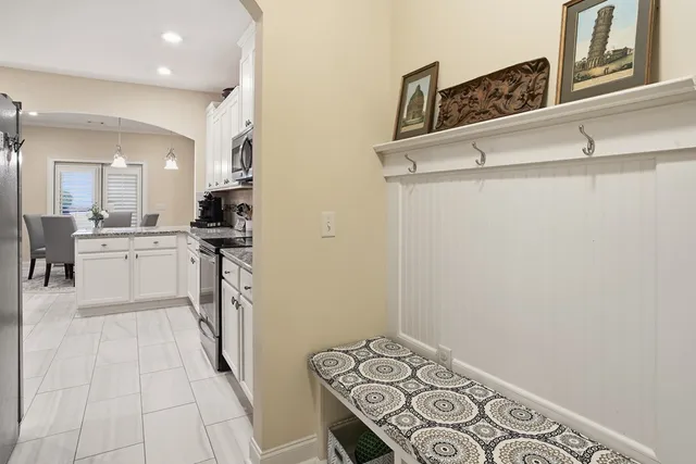 a view of a kitchen with electric appliances