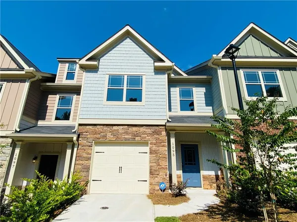 a front view of a house with yard