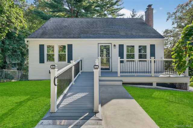 a view of a house with a yard and garden