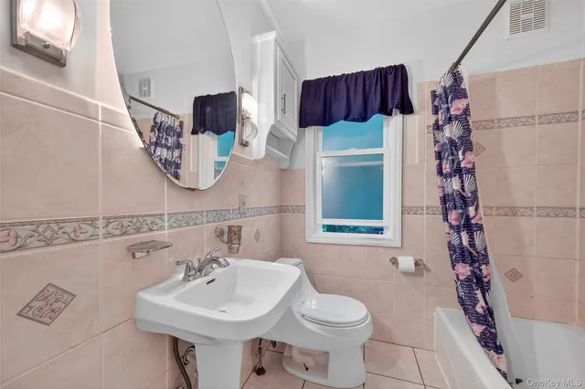 a view of a porch with wooden floor and fence