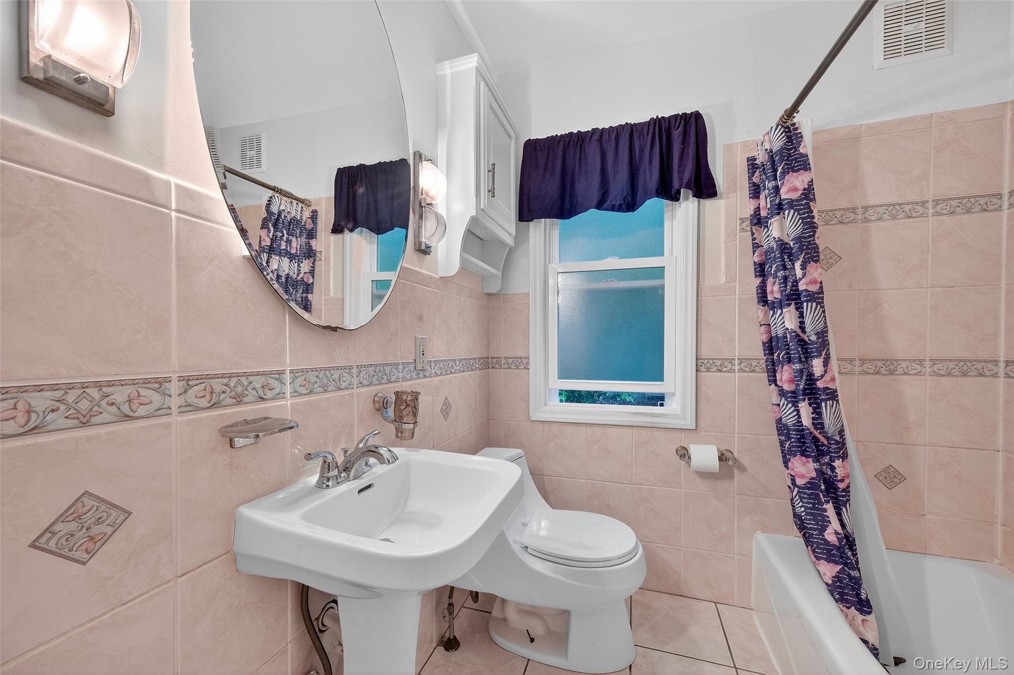 34 Mountainview Road Poughkeepsie, NY 12603 - Photo 17 of 28 a bathroom with a sink toilet and mirror