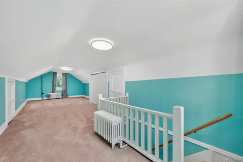 a view of a grassy field with trees