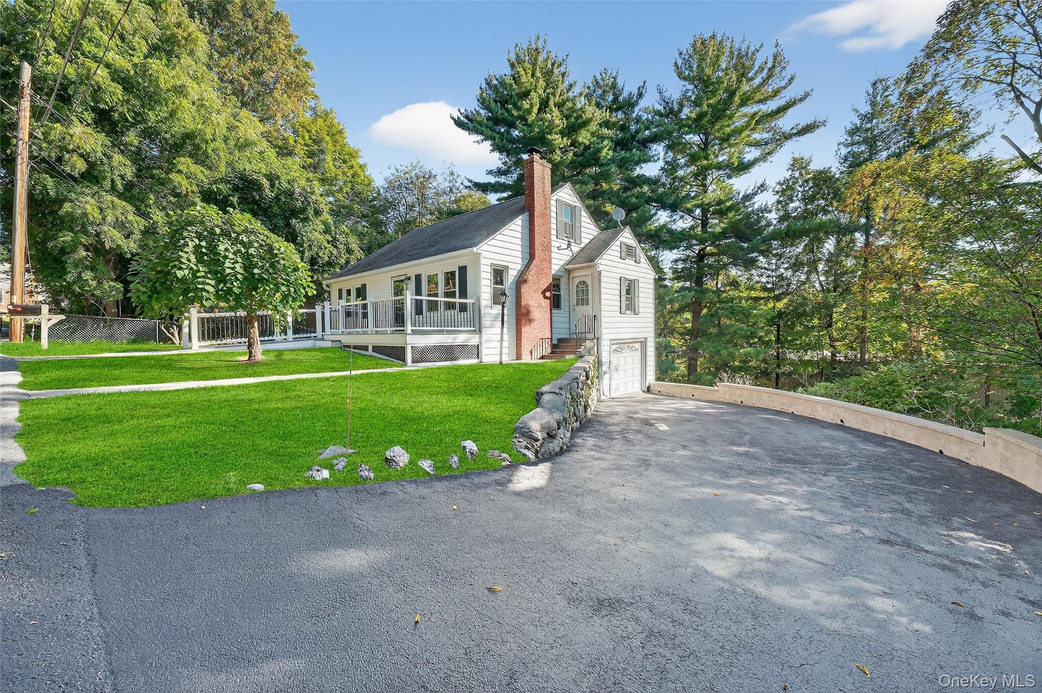 34 Mountainview Road Poughkeepsie, NY 12603 - Photo 2 of 28 a front view of a house with a yard and garage