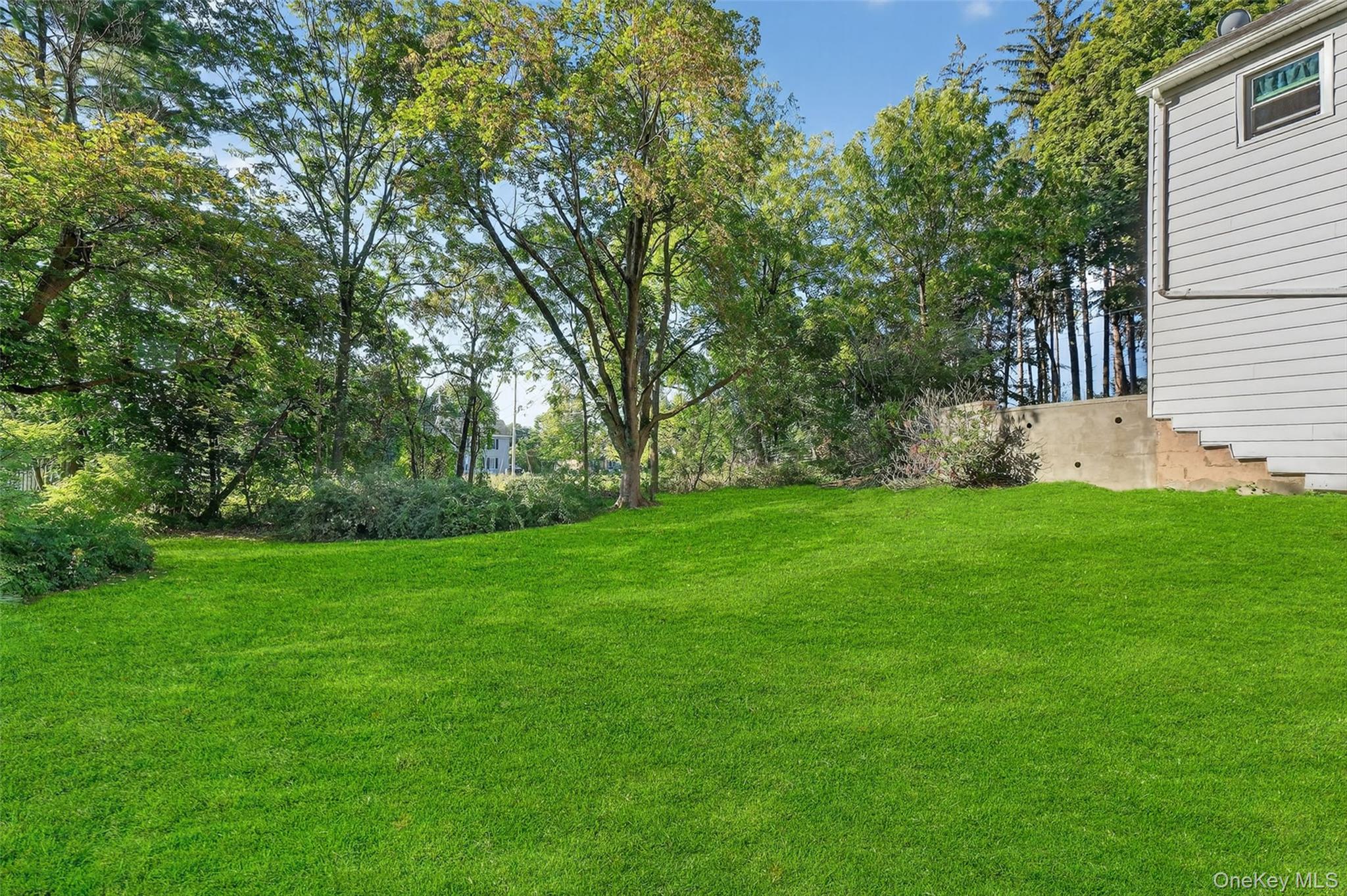 34 Mountainview Road Poughkeepsie, NY 12603 - Photo 23 of 28 a view of green field with trees in the background